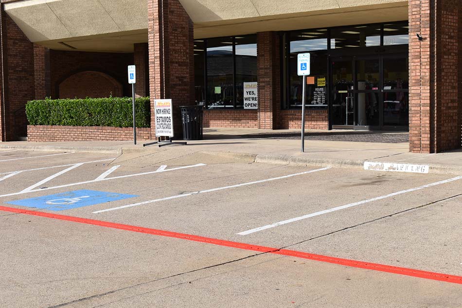 Close-up image of painted fire lane markings in a commercial parking lot.