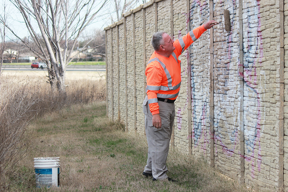 Graffiti Technician abating graffiti 