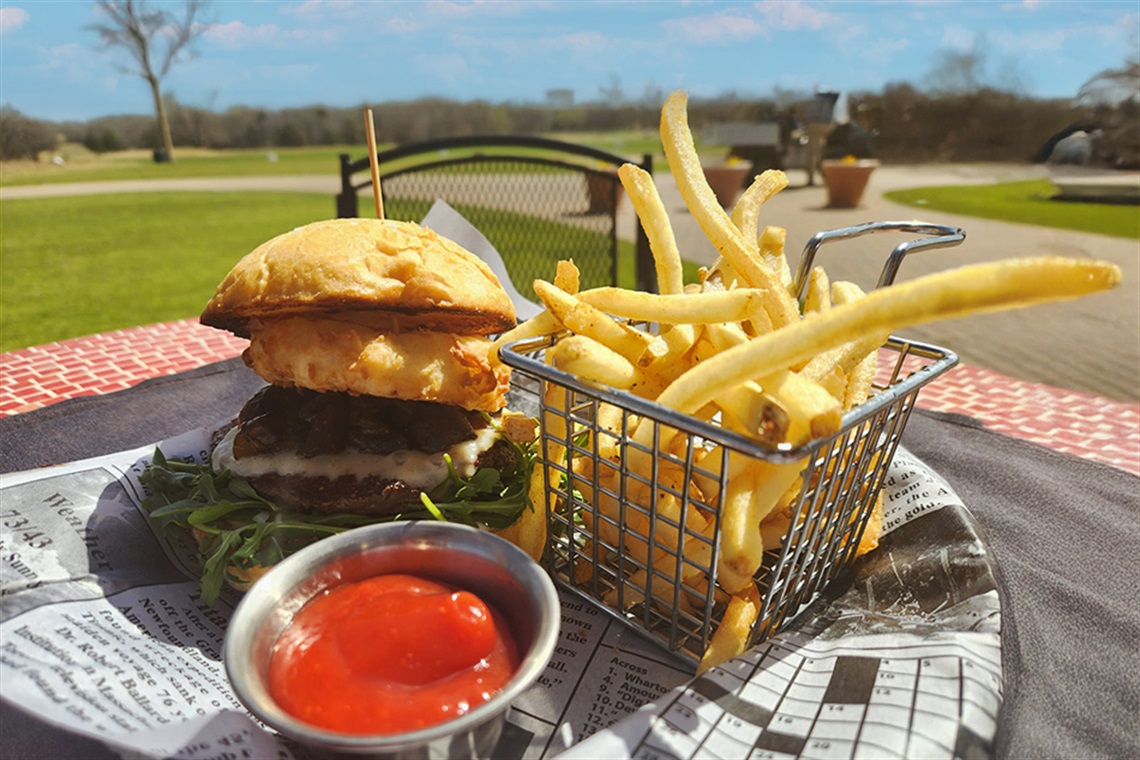 burger and fries on a table at Ventana Grille.