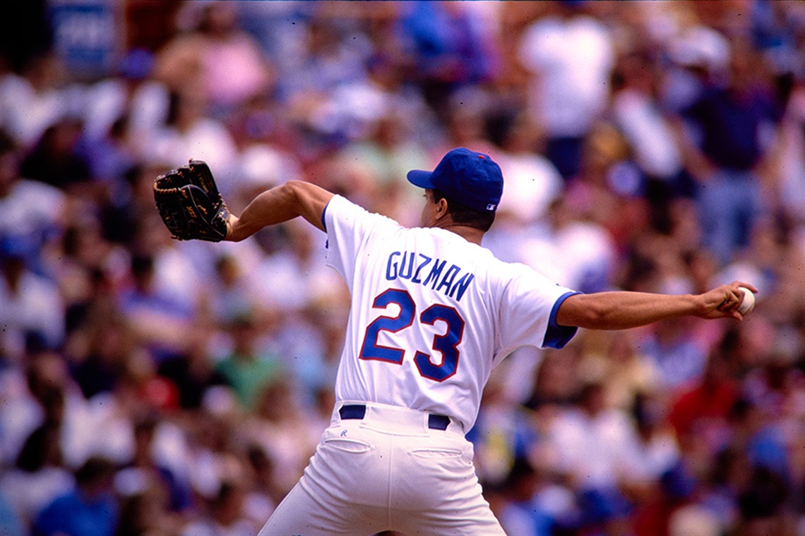 Former Texas Rangers pitcher Jose Guzman in the middle of his pitching windup.