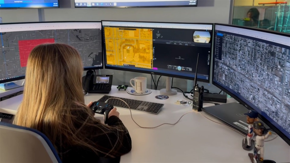 APD drone pilot remotely flying a drone