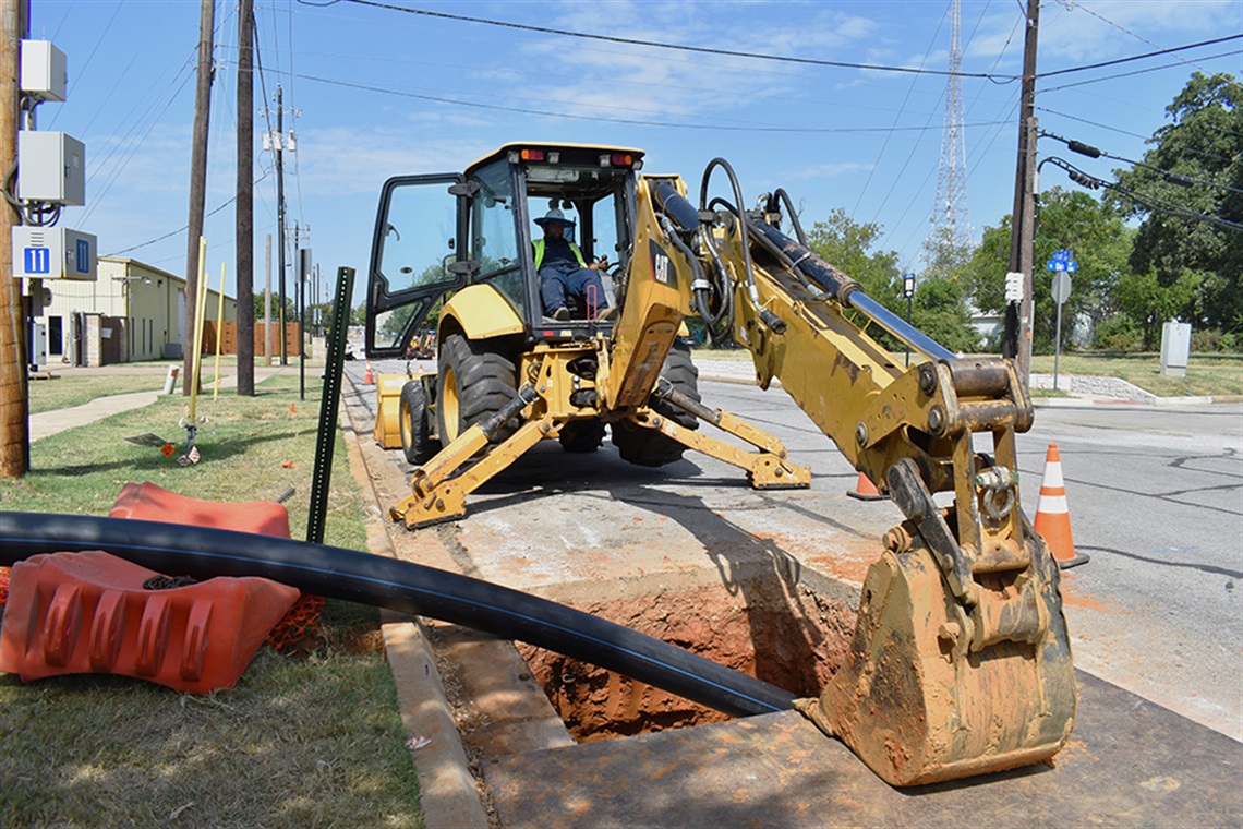 Construction crew works to fix water main. 