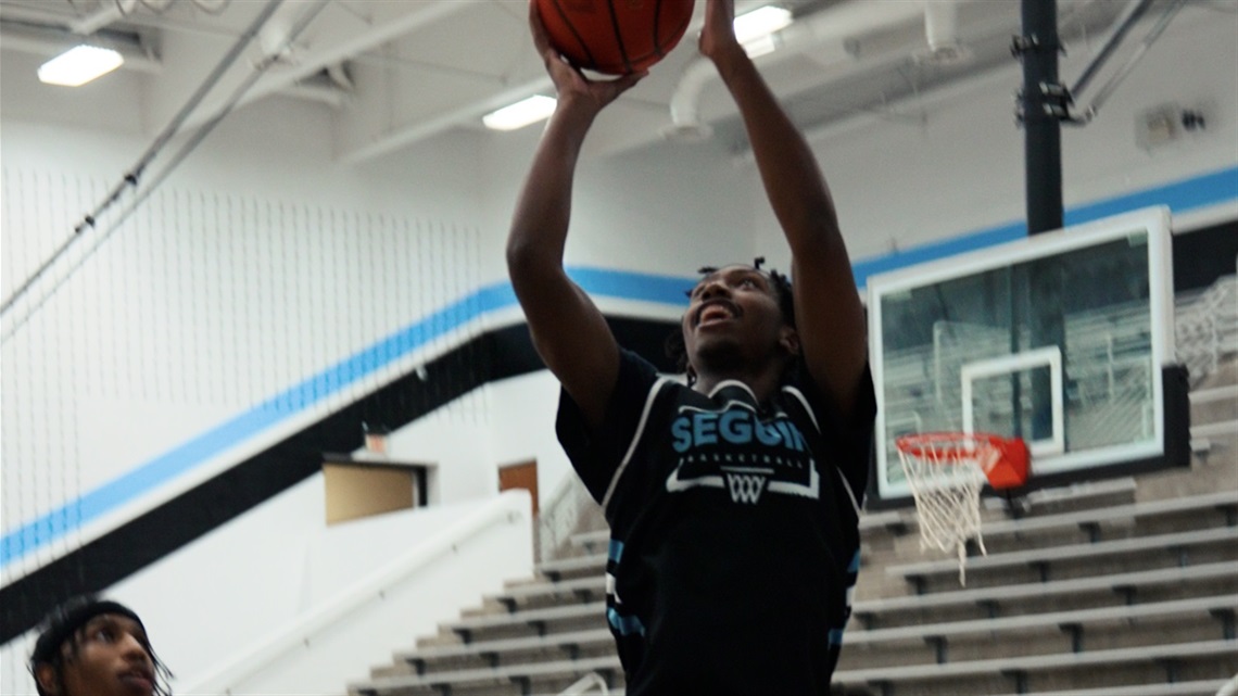 Student athlete of the month Daniel Misiani playing basketball