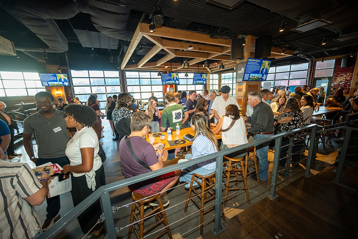 Crowd of people networking inside Texas Live!