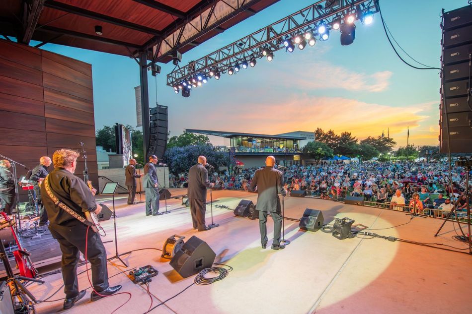 Band on stage during a free live music concert at Levitt Pavilion.