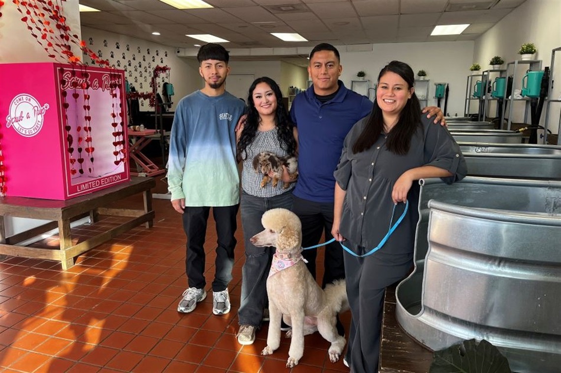 Scrub a Pup Owners with two dogs