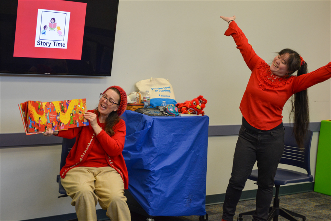Librarians showing a Lunar New Year book