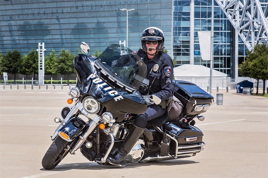 Arlington Police officer on bike in front of AT&T Stadium