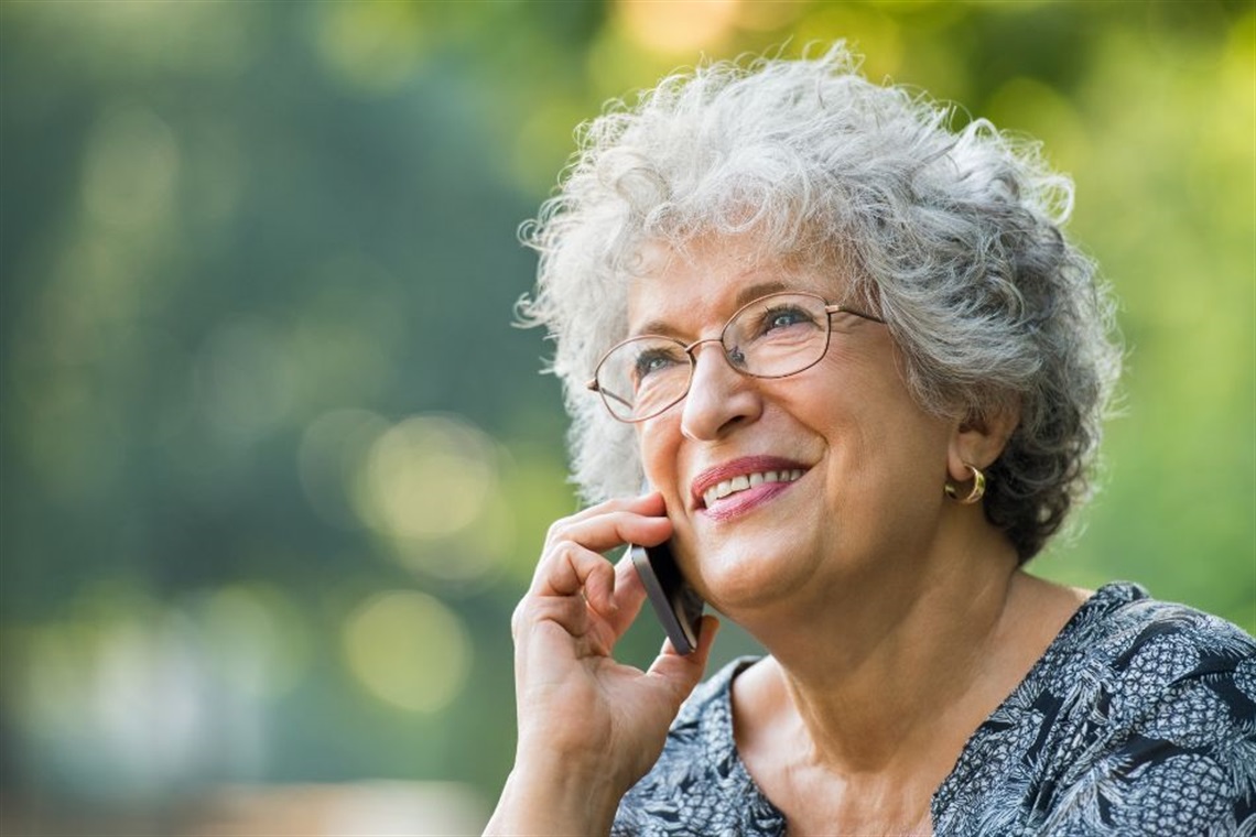A senior person talking on the phone