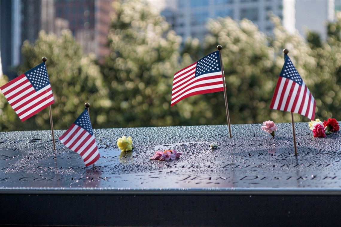 Image of small American flags at the 9/11 memorial