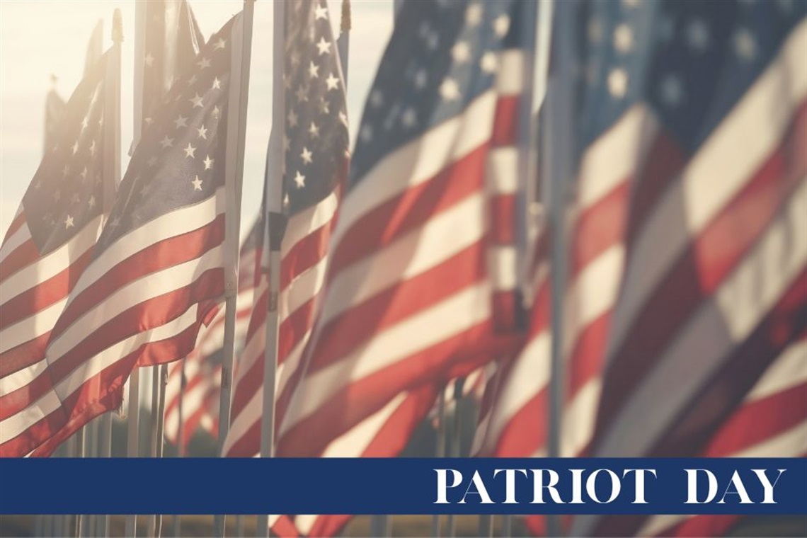 American flags with a banner that reads Patriot Day