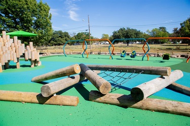 Wooden playground features at Meadowbrook Park