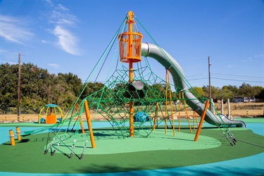 Playground with climbing ropes and slide at Meadowbrook Park