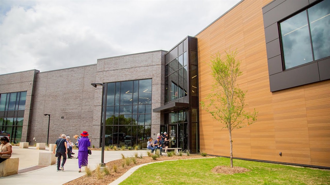 exterior view of the ACTIV center with a cloudy blue sky