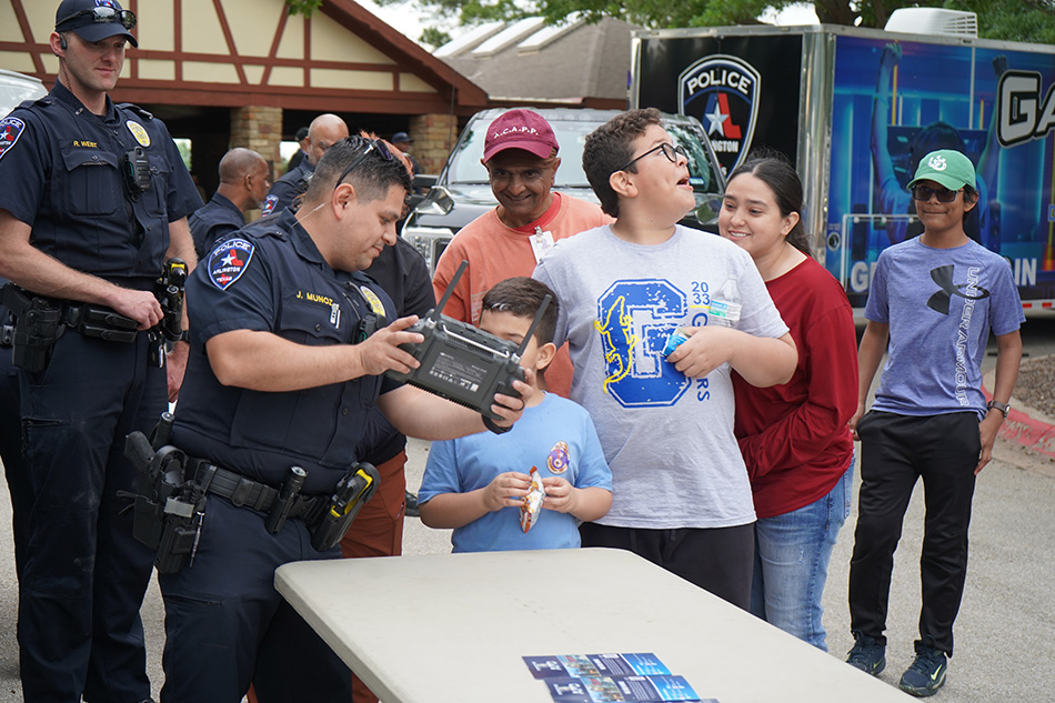 APD Officers showing community members a police drone