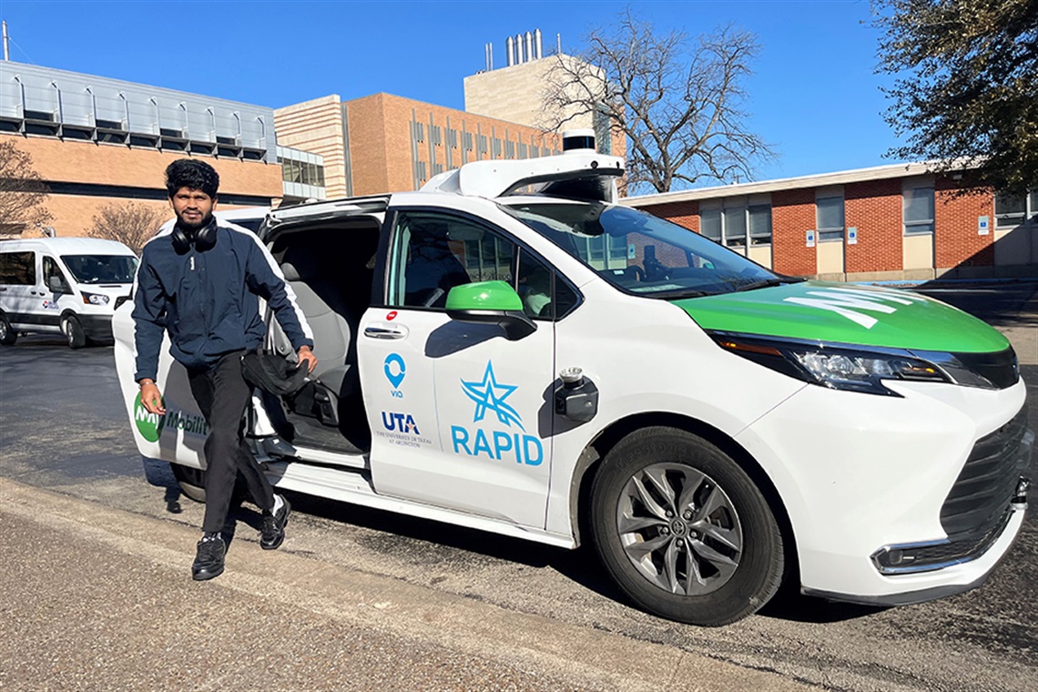 UTA student exiting a RAPID Autonomous Rideshare Vehicle