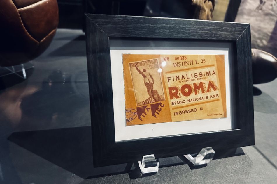 A framed vintage ticket stub labeled 