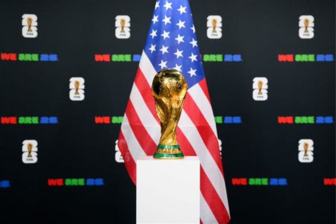 World Cup Trophy with the US flag in the background.