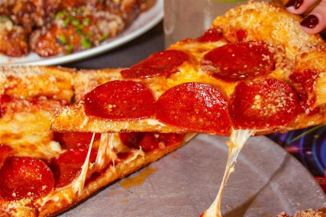 A slice of pepperoni pizza
