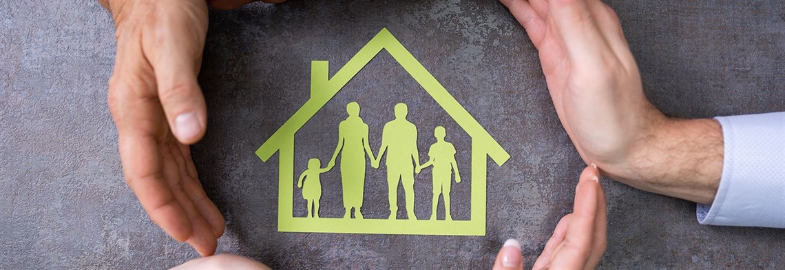 green outline of house circled by hands