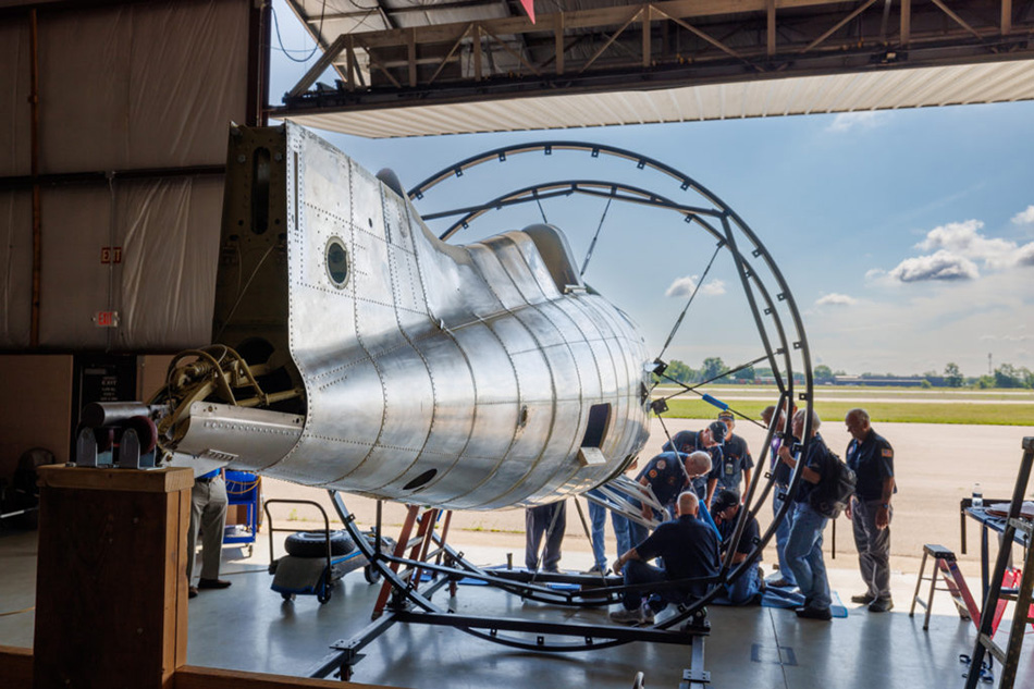 The Air Zoo Restoration team works on the main landing gear for the Wildcat fighter slated to be displayed at the National Medal of Honor Museum