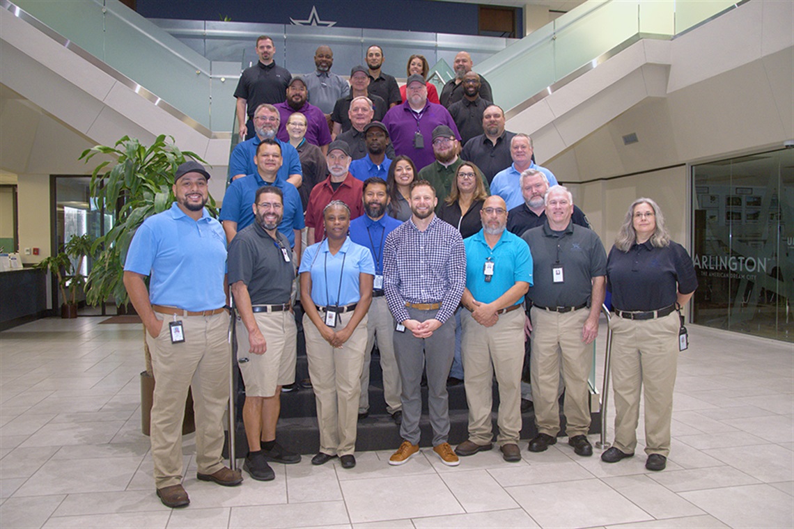 Staff members of the Code Compliance pose for photo inside City Hall.