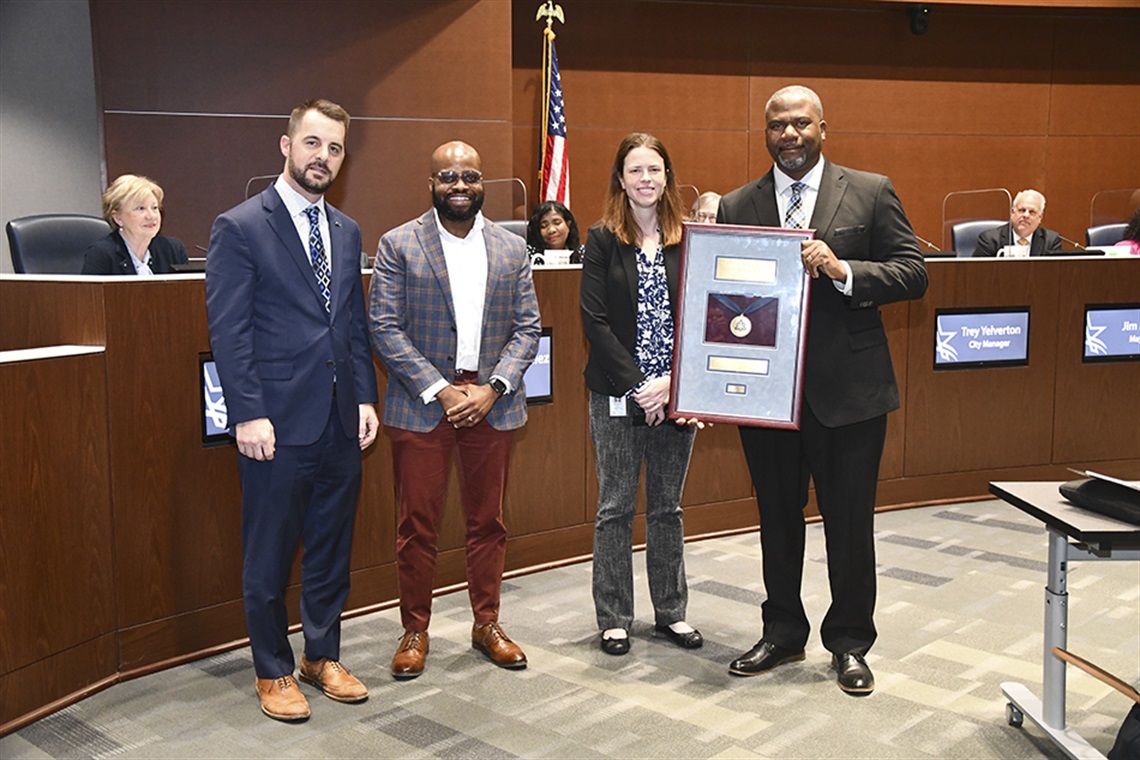The City of Arlington Public Works Department accepts the American Public Works Association (APWA) award.