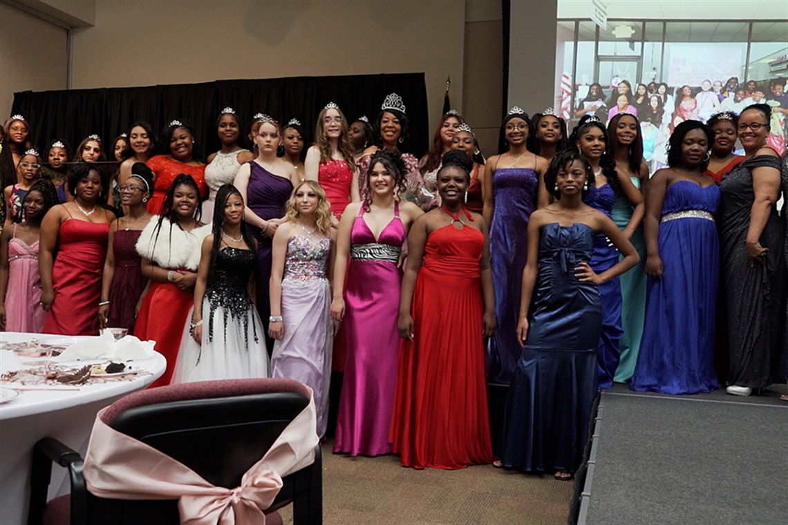 Students from T.A. Howard and Nichols Junior High pose for photo at the GRACE Program's end-of-year fashion show and high tea. 