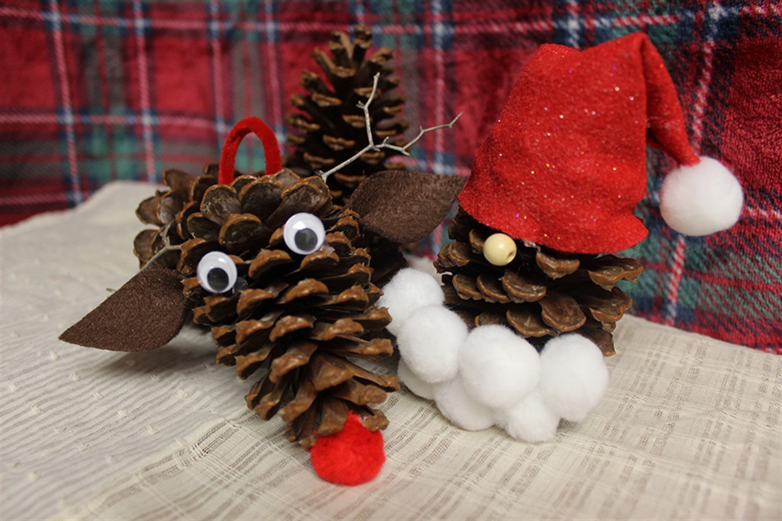 pinecone crafted to look like Santa and a reindeer