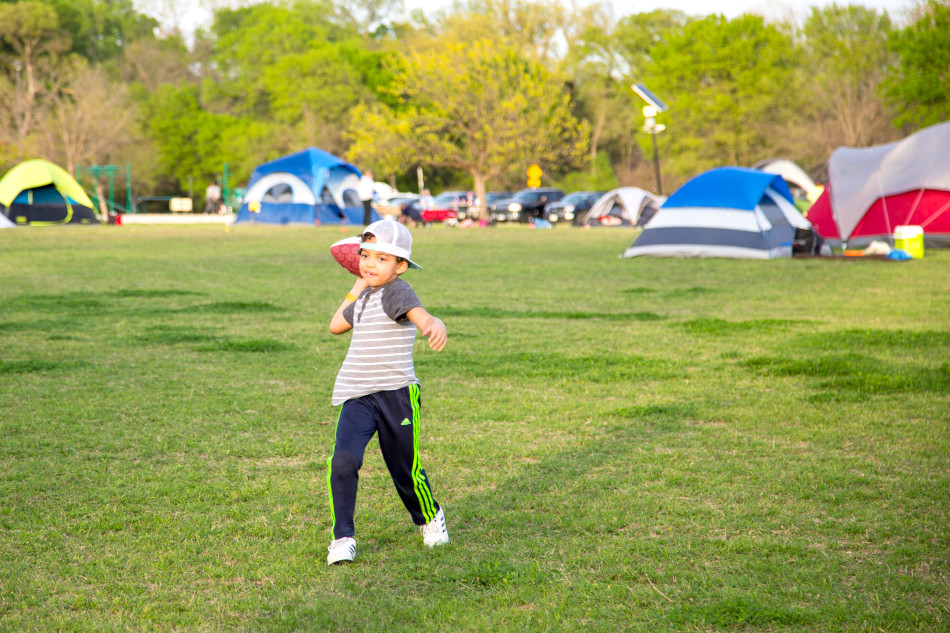 Young boy throwing a football Young boy throwing a football