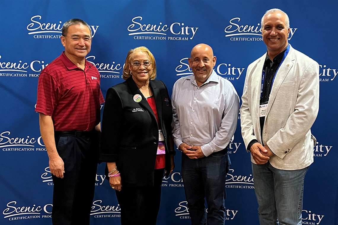 From left to right stands District 6 Councilman Long Pham, District 8 Councilwoman Dr. Barbara Odom-Wesley, District 2 Councilman Raul H. Gonzalez, and District 1 Councilman Mauricio Galante standing to accept an award.