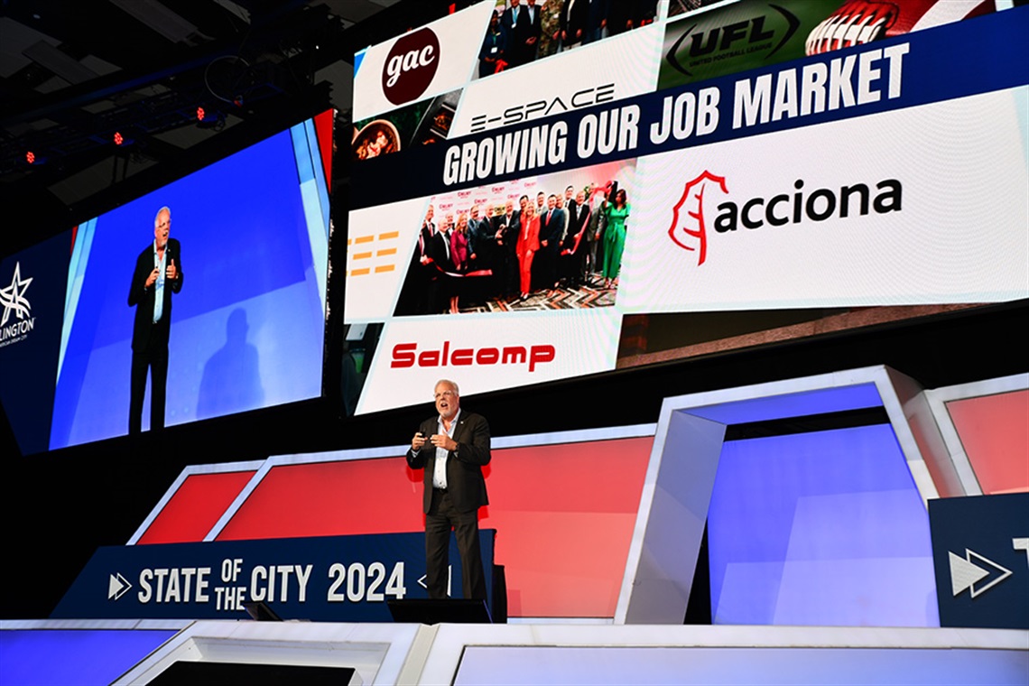 Arlington Mayor Jim Ross stands on stage delivering the 2024 State of The City address.