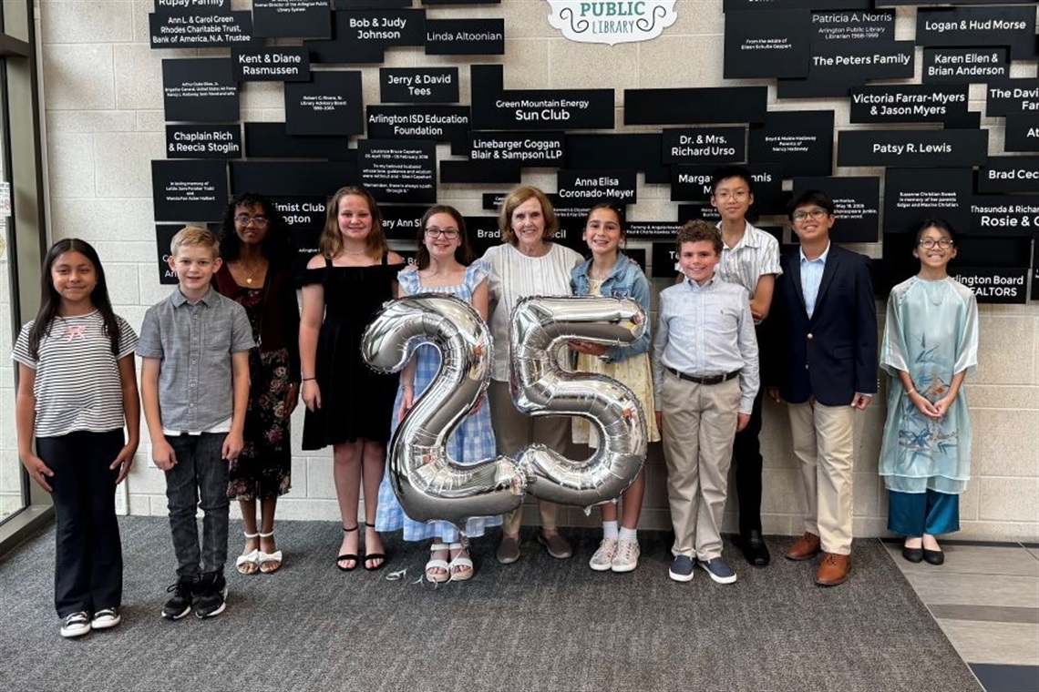 Group of children posing outside City Hall
