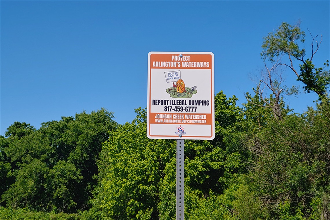 Sign that reads Protect Arlington's Waterways