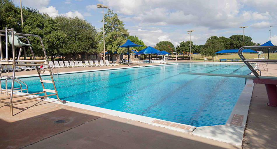 side view of Allen Bolden Pool showing pool pavilions in the background