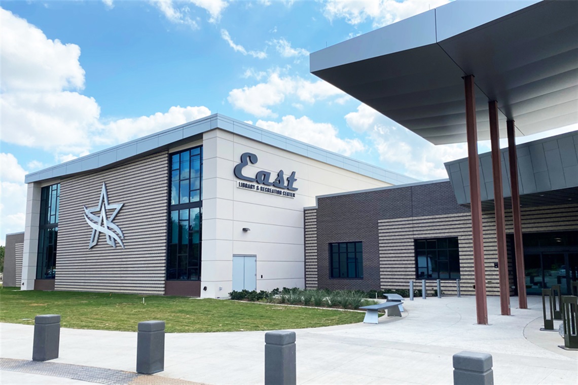 Front of East Library and Recreation Center with a sunny blue sky