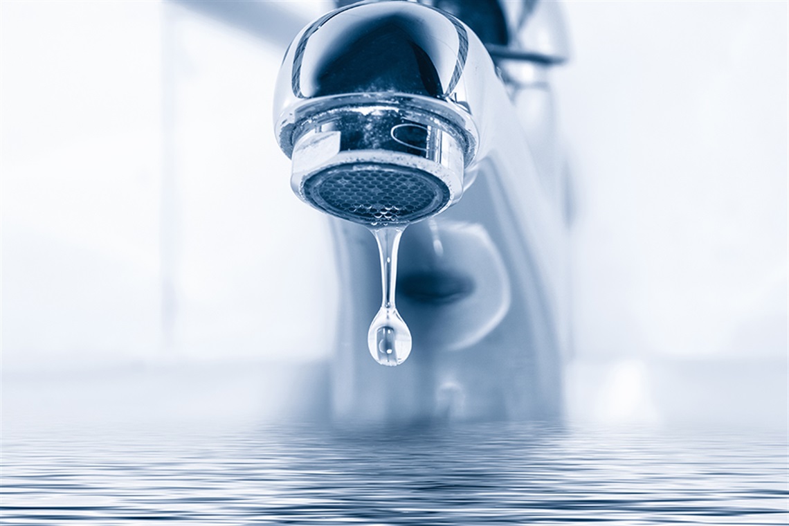 photo of a faucet dripping water